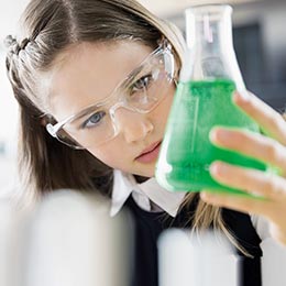 scientist holding conical flask