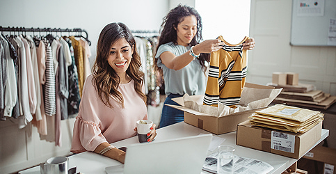 two women packing merchandise