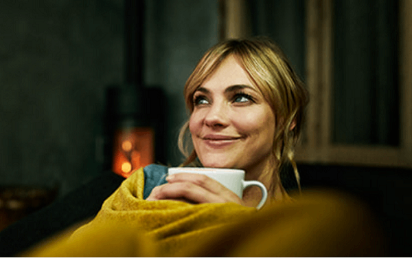 Lady pondering over a coffee