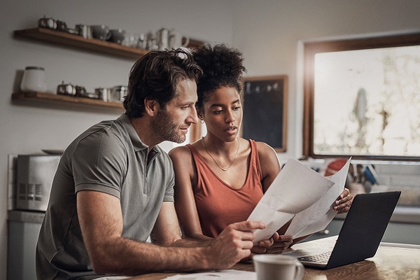 An image of a young couple revieing their finances.