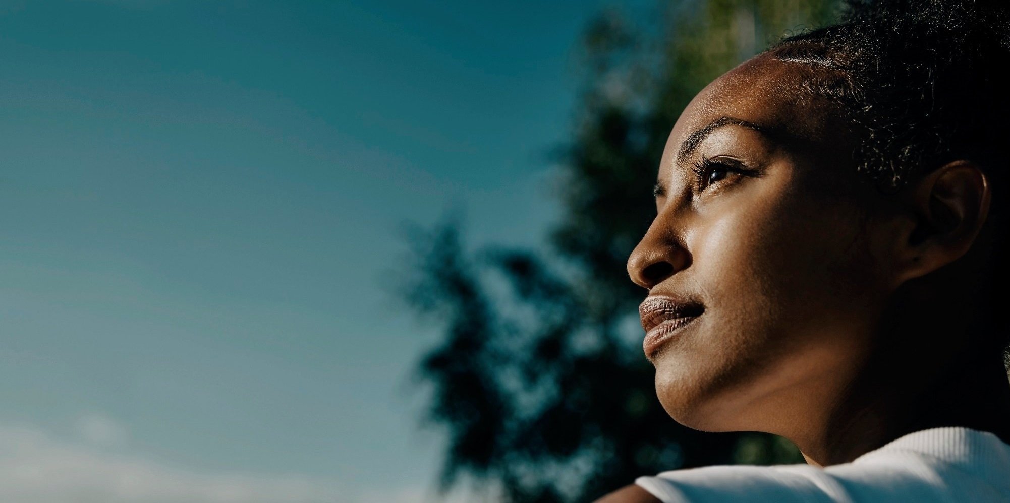 An image of a lady in a countryside setting.