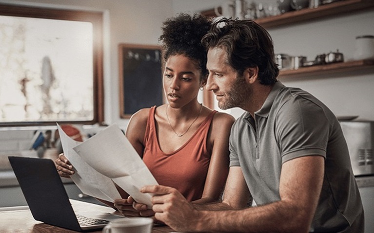 An image of a couple reviewing documents.