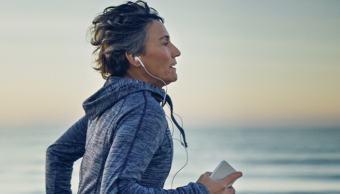 Lady jogging on the beach