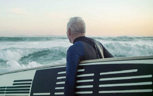 Man holding surfboard